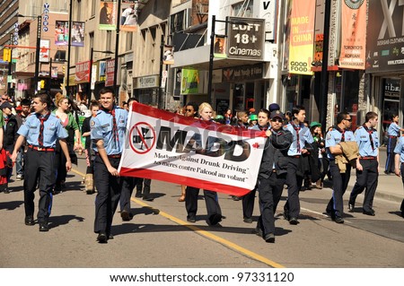 TORONTO, CANADA - MARCH 11:  Supporters of Mothers Against Drunk Driving march in the annual St Patrick’s Day Parade, March 11, 2012 in Toronto, Ontario.