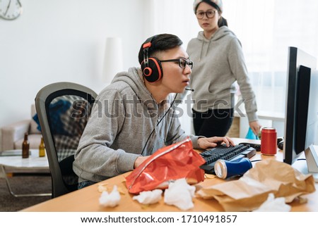 Similar – Image, Stock Photo Unhappy girl playing video game in evening time