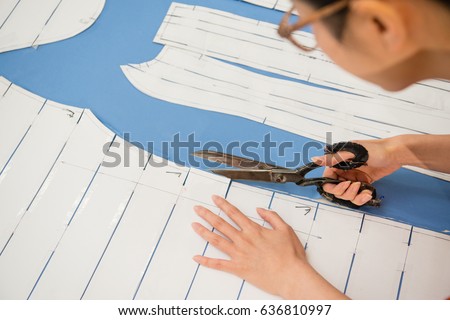 Similar – Image, Stock Photo Female tailor drawing cutout in workshop