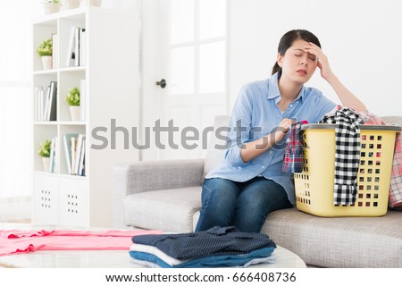 Similar – Image, Stock Photo Getting laundry out of the washing machine