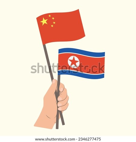 Flags of China and North Korea, Hand Holding flags