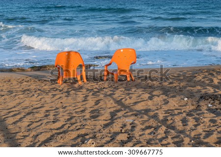 peaceful calm sea and two lonely chair.