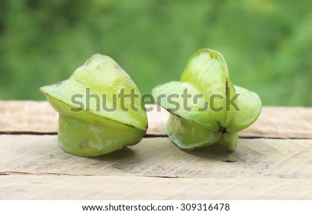 Star apple Carambola (Star Fruit) Fresh ripe star fruit in a wooden