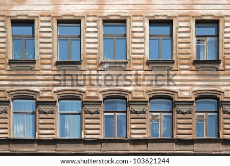 Old house windows decorated with relief details
