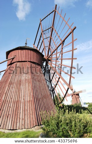 Two rare red wooden windmills. Western Finland.