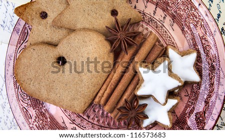 Christmas theme Still-Life with Gingerbread and Cinnamon Star Cookies and Spices on glass plate