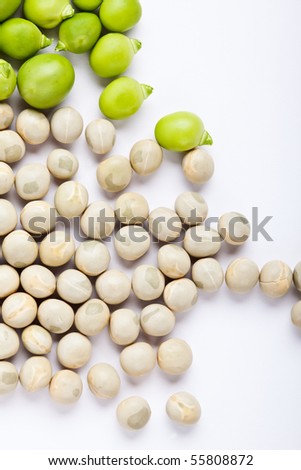 Fresh green peas and dried peas isolated on white studio shot