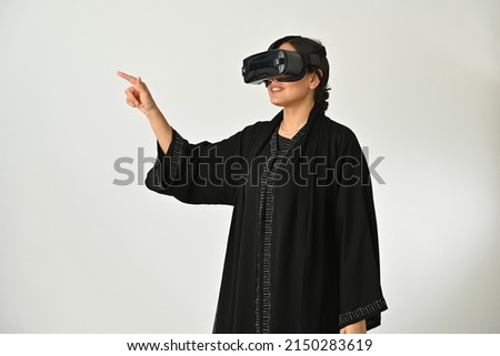 Similar – Image, Stock Photo Arab woman in VR headset on embankment