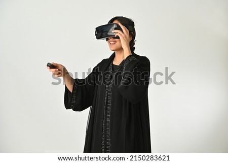 Similar – Image, Stock Photo Arab woman in VR headset on embankment