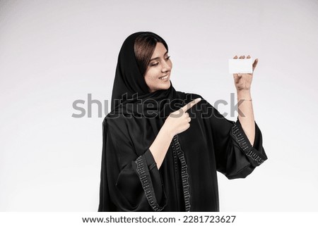 Similar – Image, Stock Photo Charming Arab woman in hijab looking at camera