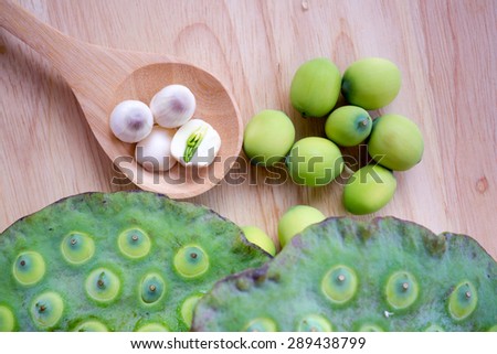 lotus seed and pod on wood background