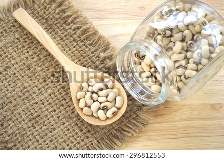 Navy bean on sackcloth and wood background