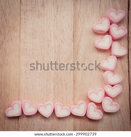 Heart shape marshmallow on wood background
