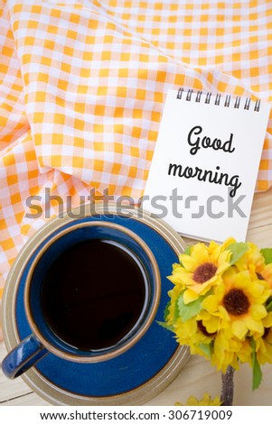 Cup of black coffee and good morning note