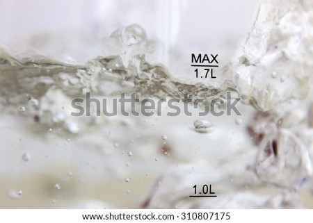 Studio photography of bubbles boiling water in an electric kettle