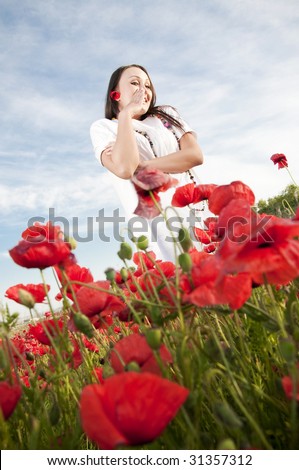 Funny woman in poppy field