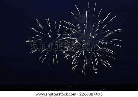 Similar – Image, Stock Photo Fireworks explode in two circles with yellow sparks from red smoke