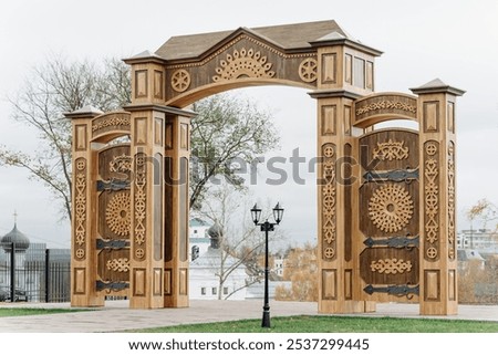 Similar – Image, Stock Photo large wooden gate with plain door handle, slanted wooden boards and painted with different green paint, which is peeling off