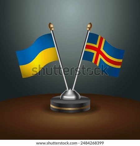 Ukraine and Aland Islands flag together. Small table flag with color gradient background