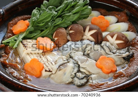 kaki dotenabe , oyster cooked in a pot at the table , japanese food