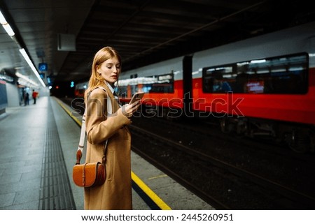 Similar – Foto Bild Fahrgast, der im Zug mit seinem Smartphone gegen das Fenster chattet