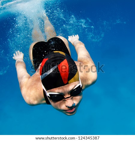 professional female sport master smiling underwater