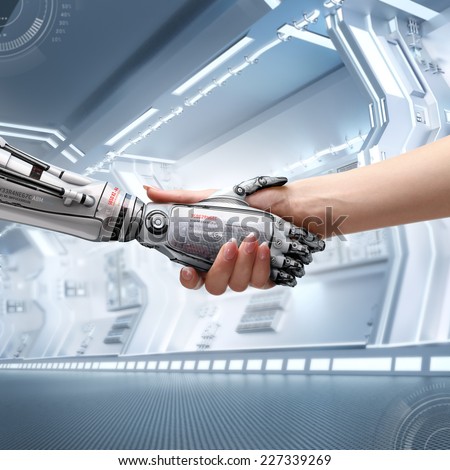 female human and robot\'s handshake as a symbol of connection between people and artificial intelligence technology