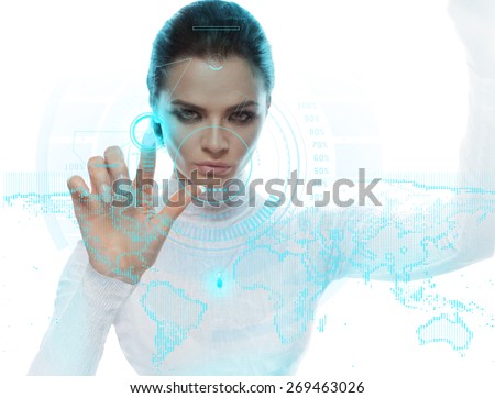Future technology Virtual Holographic interface. Hi-tech Girl touching screen. Business Young lady working with virtual Graphics in futuristic office.