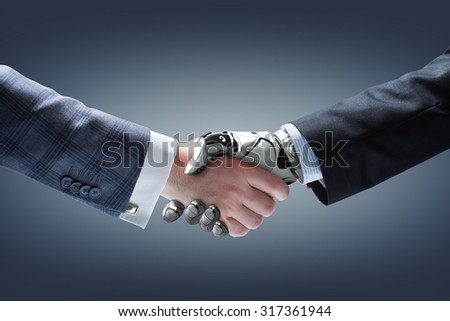 Businessman and robot\'s handshake on gradient background. Artificial intelligence technology