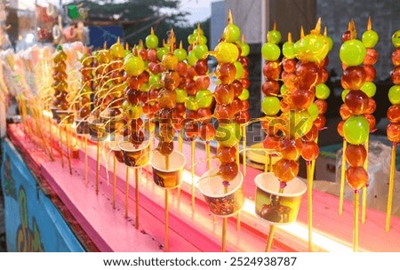 Similar – Image, Stock Photo A fresh strawberry skewered with a fork