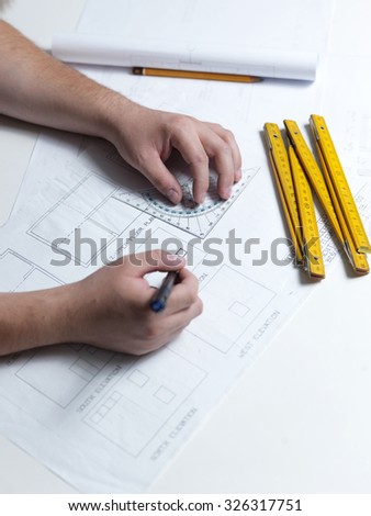 Business man draw buildings and present his architectural project