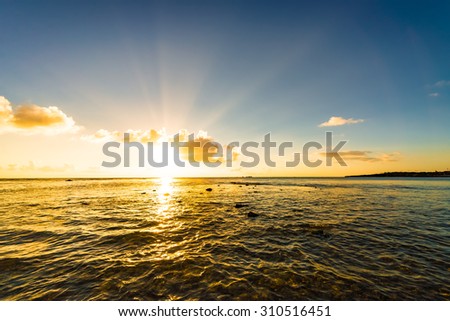 Sunset, sunbeam, sky, sea, beach. Okinawa, Japan, Asia.