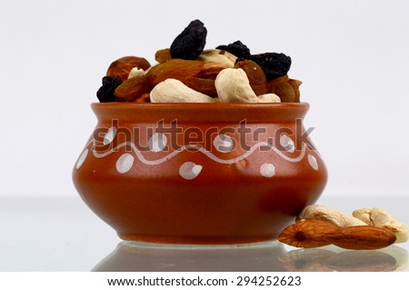 Delicious and healthy mixed dried fruit, cashews, almonds in the pot