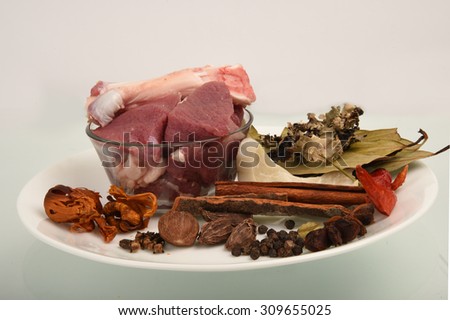 raw meat, vegetables and spices isolated on white background