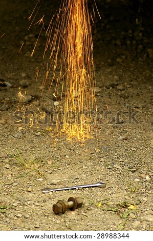 Grinder sparks falling to the ground