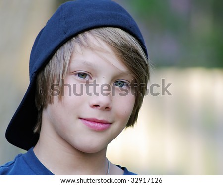Caucasian boy wearing backwards ball cap