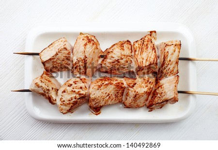 grilled pork meat  on white plate, pork barbecue