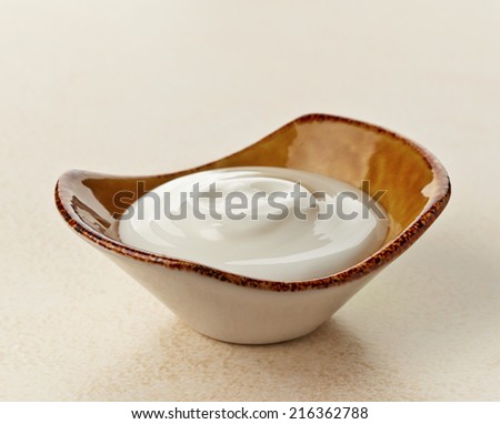 bowl of greek yogurt on kitchen table