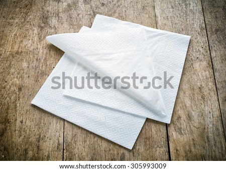 white paper napkins on old wooden table