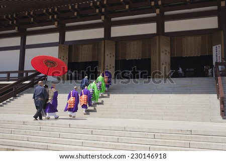 Narita, Japan - August 2, 2014: Buddhist priest walk up to a temple as they prepare for a traditional praying ritual.