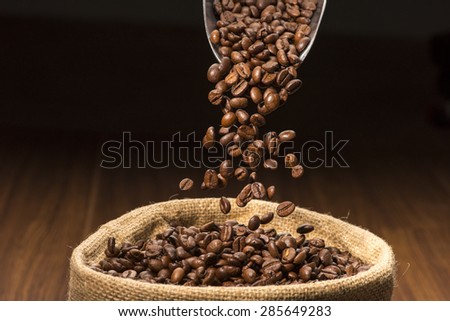 Coffee Beans Falling Into Coffee Beans Bag