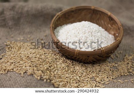 a pile of rice in pannier and sackcloth