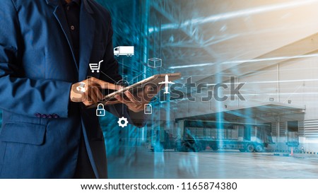 Logistic and transport concept : Businessman manager using tablet check and control and planning for Modern Trade warehouse logistics. Stock photo © 
