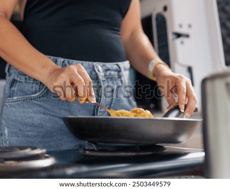 Similar – Image, Stock Photo Scrambled eggs in a blue plate, top view on a yellow table.