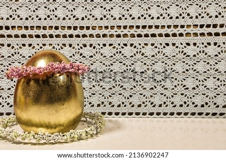 Easter egg in gold with deko Stock foto © 