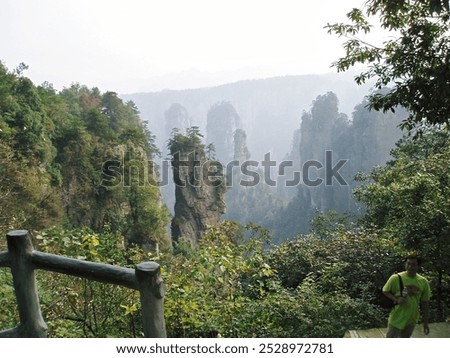 Similar – Foto Bild Felsen, der unter Wolkenverhangenem Himmel mickrig klein wirkt.