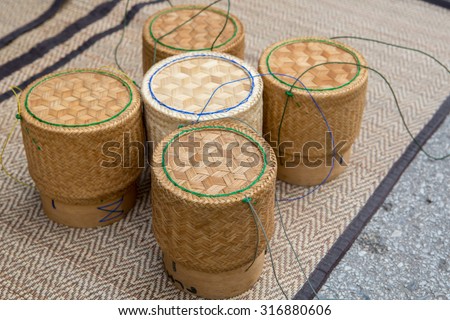 Thai traditional rice box It is called Kratib wicker container made of bamboo, for packing sticky rice. More common in Thailand and Laos material used for put glutinous rice of people in countryside