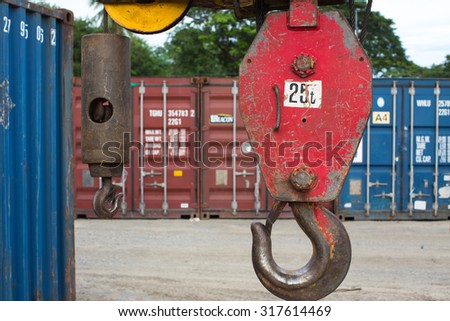 Red Crane Hook 25t isolated \
An hoist on top industry place .\
Big metal hook with chain isolated