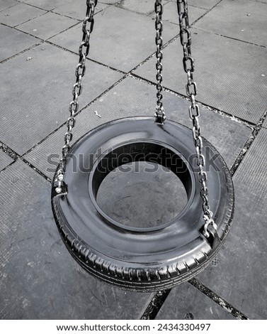 Similar – Image, Stock Photo black chain Tire Swing at a children’s  play ground no people