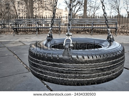 Similar – Image, Stock Photo black chain Tire Swing at a children’s  play ground no people